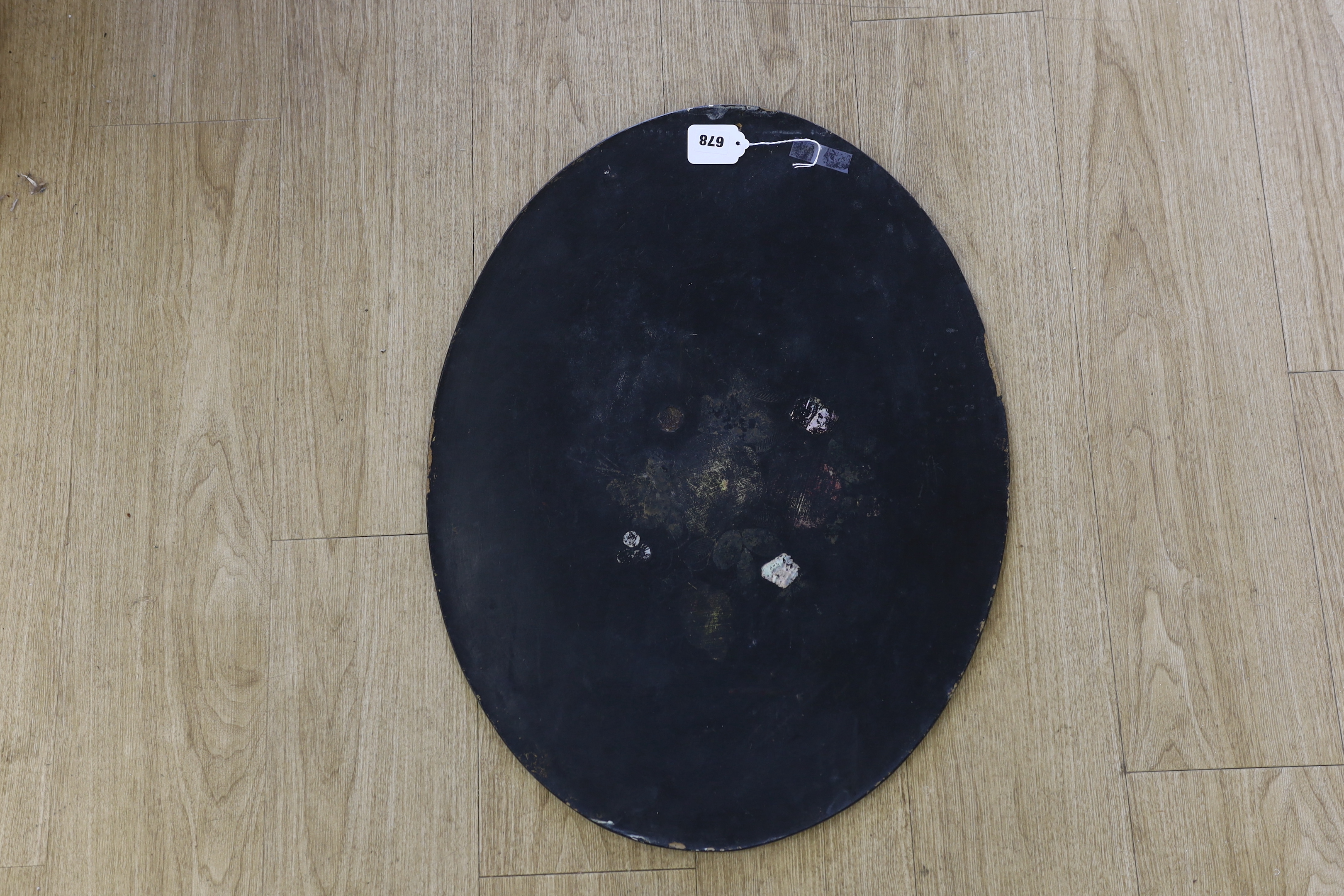 A Japanese oval lacquer panel, 66cm long